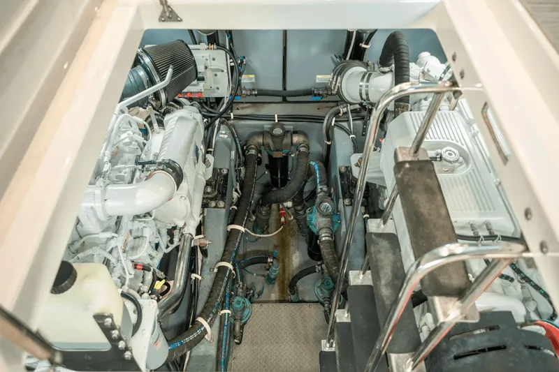Telesto Yacht Photos Pics Engine room of 2017 Carver 52 Command Bridge yacht, showcasing mechanical components and systems.