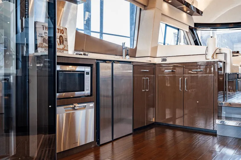 Telesto Yacht Photos Pics Luxurious kitchen interior of 2017 Carver 52 Command Bridge yacht with modern appliances.