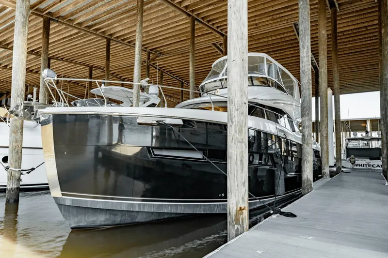 Telesto Yacht Photos Pics 2017 Carver 52 Command Bridge yacht docked in a covered marina.
