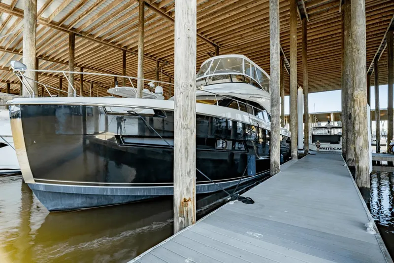 Telesto Yacht Photos Pics 2017 Carver 52 Command Bridge yacht docked in a covered marina.
