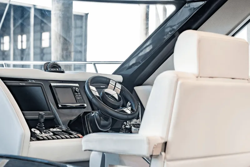 Telesto Yacht Photos Pics Interior of 2017 Carver 52 Command Bridge yacht, featuring modern helm and controls.