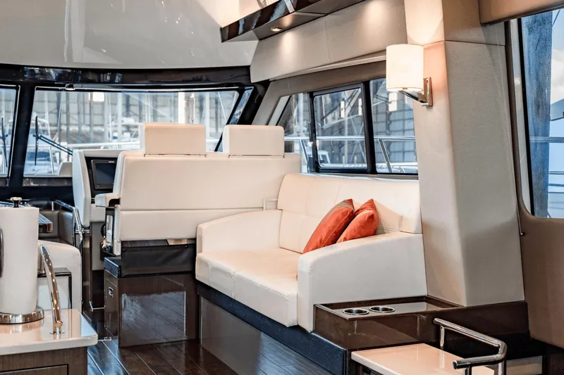 Telesto Yacht Photos Pics Luxurious interior of 2017 Carver 52 Command Bridge yacht with elegant seating and modern design.