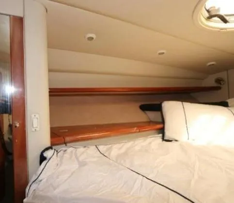  Yacht Photos Pics Interior cabin of 2000 Sunseeker Superhawk 48 Mk II yacht, featuring a cozy bed.