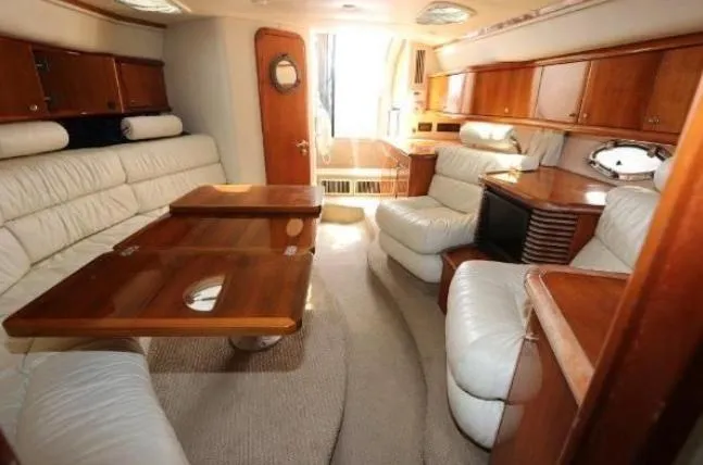  Yacht Photos Pics Luxurious interior of 2000 Sunseeker Superhawk 48 Mk II yacht with elegant wood and leather furnishings.