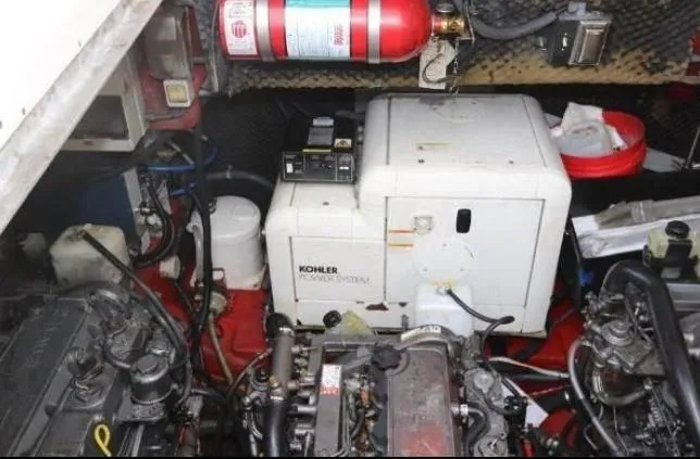  Yacht Photos Pics Engine room of 2000 Sunseeker Superhawk 48 Mk II with Kohler generator and fire extinguisher.