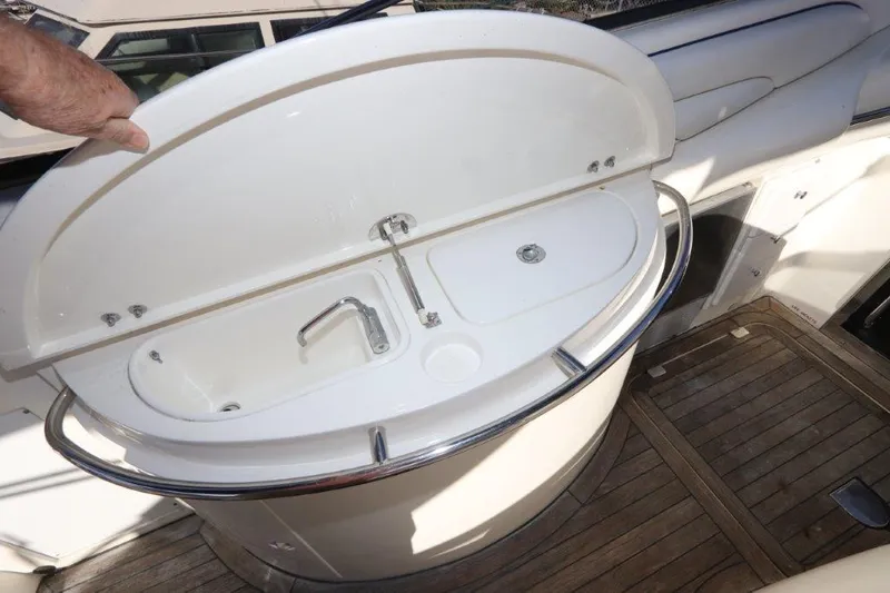  Yacht Photos Pics Sunseeker Superhawk 48 Mk II 2000 yacht sink with wooden deck and open cover.