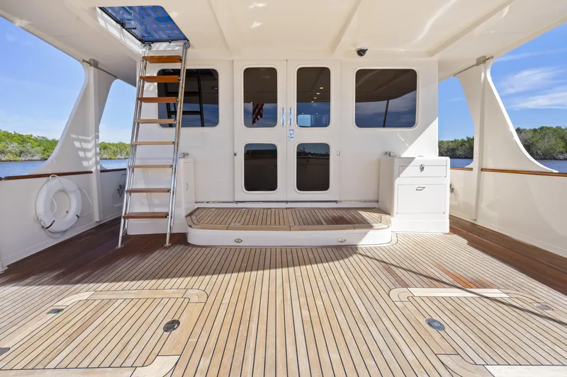  Yacht Photos Pics Spacious deck of 2023 Fleming 65 yacht with wooden flooring and modern design.