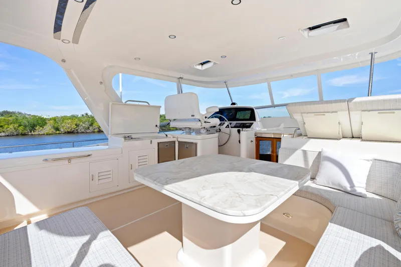  Yacht Photos Pics Luxurious interior of 2023 Fleming 65 yacht with elegant seating and modern amenities.