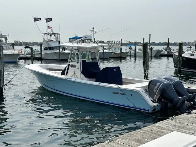  Yacht Photos Pics 2005 Regulator 32 Forward Seating boat docked in harbor.