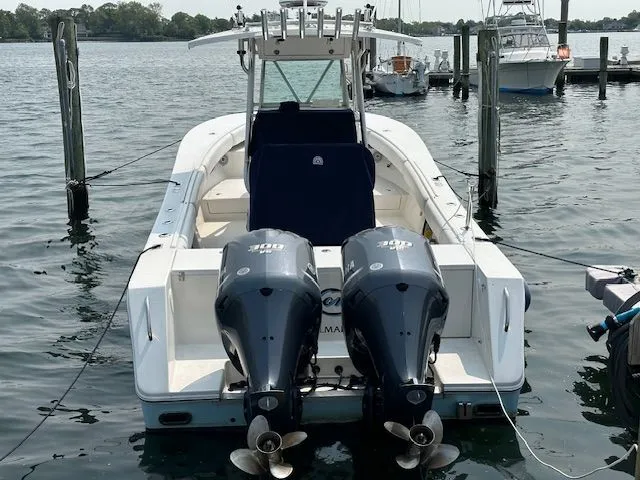  Yacht Photos Pics 2005 Regulator 32 Forward Seating boat docked at marina.
