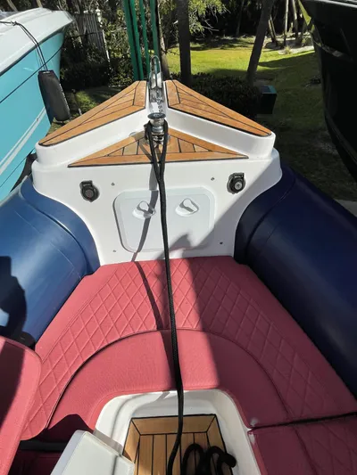  Yacht Photos Pics RIB 30 boat interior, 2022 model, featuring red seating and wooden accents.