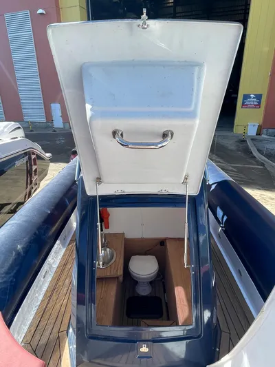  Yacht Photos Pics RIB 30 boat interior with open hatch, showing toilet and sink, 2022 model.