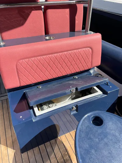  Yacht Photos Pics Red and blue seating with storage on a 2022 RIB 30 boat.