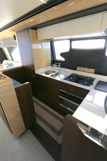 This Is It Yacht Photos Pics Luxurious kitchen interior of 2019 Azimut 72 Flybridge yacht with modern appliances.