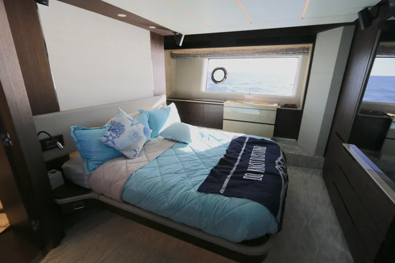 This Is It Yacht Photos Pics Luxurious bedroom interior of 2019 Azimut 72 Flybridge yacht with ocean view.