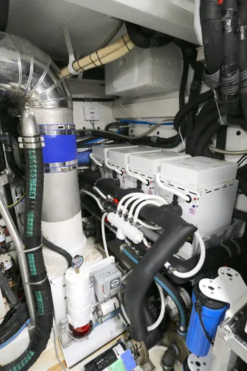 This Is It Yacht Photos Pics Engine room of 2019 Azimut 72 Flybridge yacht with complex piping and machinery.