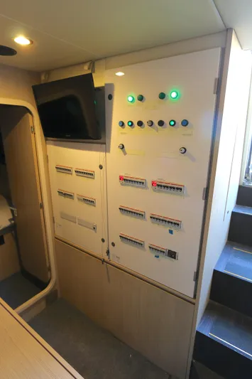 This Is It Yacht Photos Pics Control panel inside 2019 Azimut 72 Flybridge yacht, featuring switches and indicators.