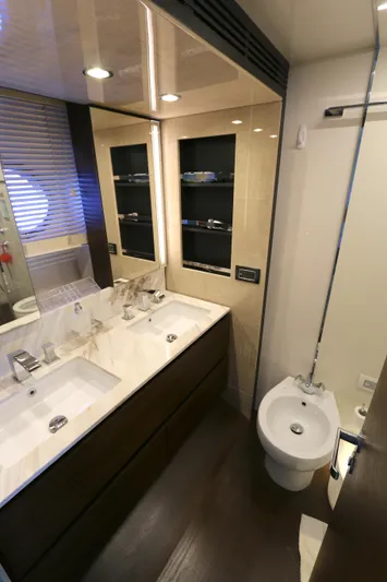 This Is It Yacht Photos Pics Luxurious bathroom in 2019 Azimut 72 Flybridge yacht with modern fixtures and dual sinks.