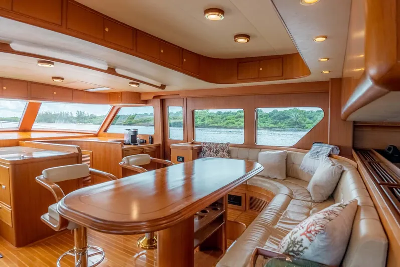 Someday Came Yacht Photos Pics Luxurious interior of 2006 Marlow 72E LRC yacht with elegant wood finishes.