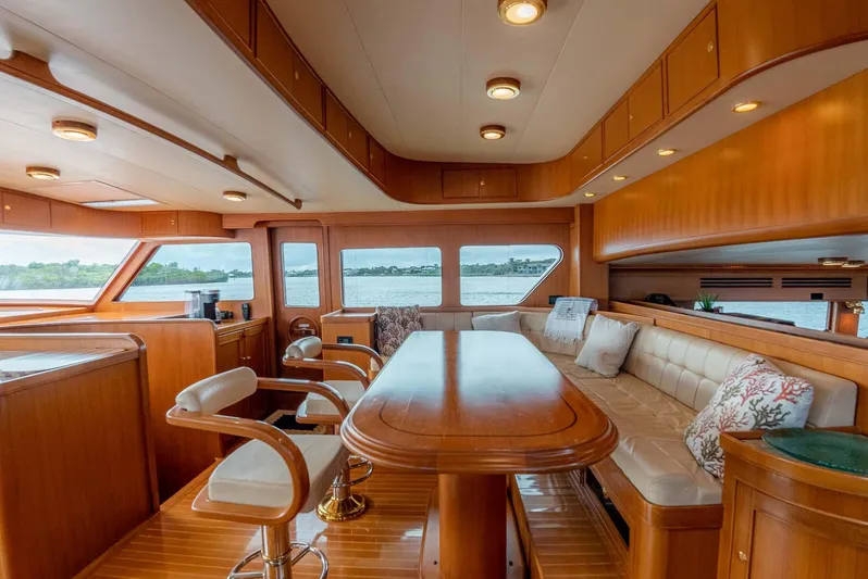 Someday Came Yacht Photos Pics Luxurious interior of 2006 Marlow 72E LRC yacht with elegant wood finishes.
