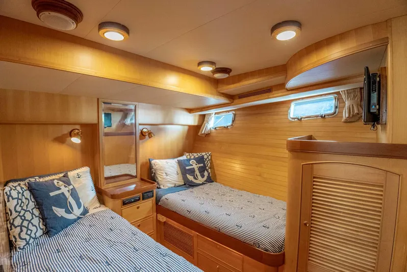 Someday Came Yacht Photos Pics Cozy twin cabin in 2006 Marlow 72E LRC yacht with nautical decor.