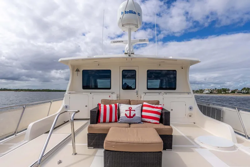 Someday Came Yacht Photos Pics Luxury 2006 Marlow 72E LRC yacht deck with stylish seating and nautical decor.