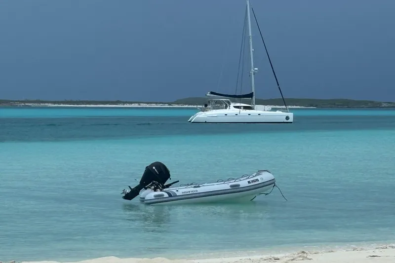 Thalassa Yacht Photos Pics Fountaine Pajot Bahia 46 catamaran anchored in turquoise waters, 2005 model.