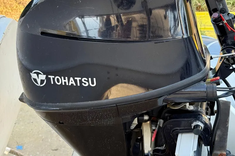 Thalassa Yacht Photos Pics Tohatsu outboard motor on a 2005 Fountaine Pajot Bahia 46 catamaran.