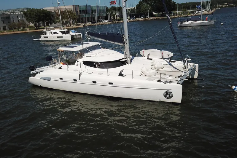 Thalassa Yacht Photos Pics 2005 Fountaine Pajot Bahia 46 catamaran anchored in a marina.