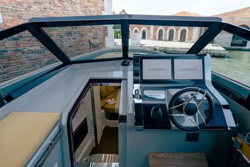 Evo R4 Wa Yacht Photos Pics 2024 Evo Yachts R4 WA cockpit with Garmin navigation, sleek design, and luxurious interior.