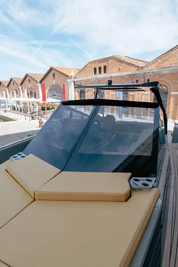 Evo R4 Wa Yacht Photos Pics 2024 Evo Yachts R4 WA with sleek design, docked near historic brick buildings.