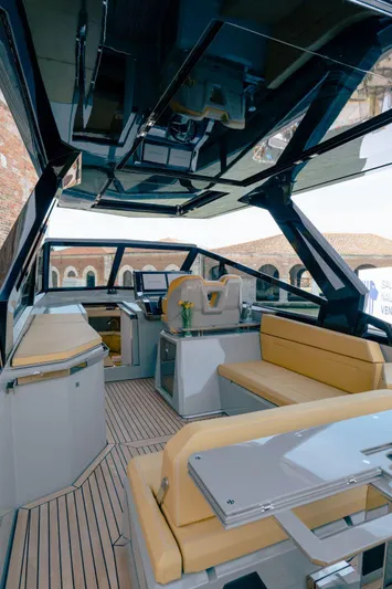 Evo R4 Wa Yacht Photos Pics 2024 Evo Yachts R4 WA interior with modern design, featuring beige seating and sleek finishes.