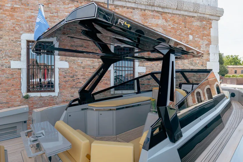 Evo R4 Wa Yacht Photos Pics 2024 Evo Yachts R4 WA luxury yacht with sleek design and modern features, docked near brick building.