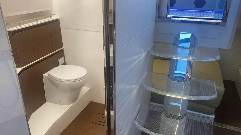 Evo R4 Wa Yacht Photos Pics Interior of 2024 Evo Yachts R4 WA, featuring modern bathroom and sleek staircase design.