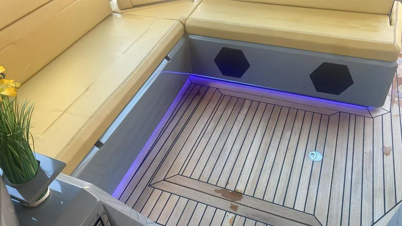 Evo R4 Wa Yacht Photos Pics Luxurious seating area on 2024 Evo Yachts R4 WA with elegant wood flooring and ambient lighting.