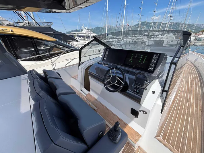 Barbarossa Yacht Photos Pics 2024 Fiart 43 Seawalker yacht helm with modern controls and luxurious seating.