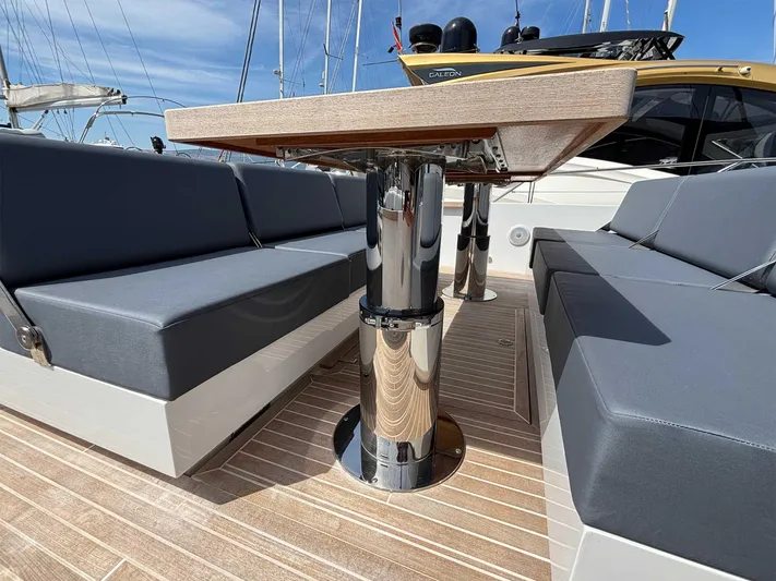 Barbarossa Yacht Photos Pics 2024 Fiart 43 Seawalker yacht interior with sleek seating and polished table.