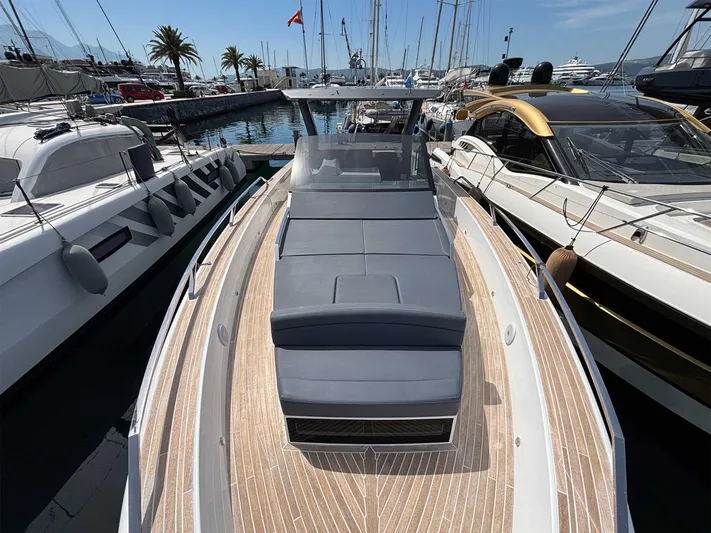 Barbarossa Yacht Photos Pics 2024 Fiart 43 Seawalker yacht docked at marina, featuring sleek design and spacious deck.