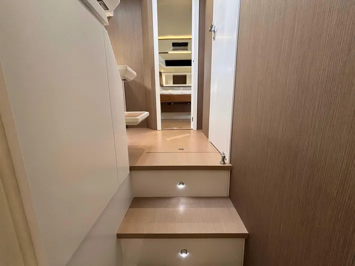 Barbarossa Yacht Photos Pics Interior of 2024 Fiart 43 Seawalker yacht, featuring modern wooden stairs and sleek design.