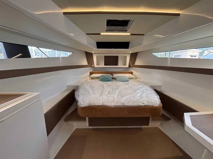 Barbarossa Yacht Photos Pics Luxurious cabin interior of 2024 Fiart 43 Seawalker yacht with cozy bed.