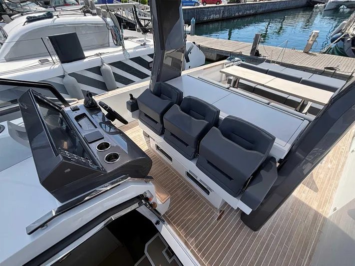 Barbarossa Yacht Photos Pics 2024 Fiart 43 Seawalker yacht with sleek seating and modern dashboard at a marina.