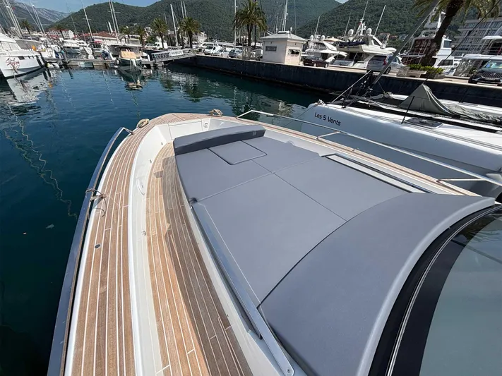 Barbarossa Yacht Photos Pics 2024 Fiart 43 Seawalker yacht docked in a marina, showcasing sleek design and spacious deck.
