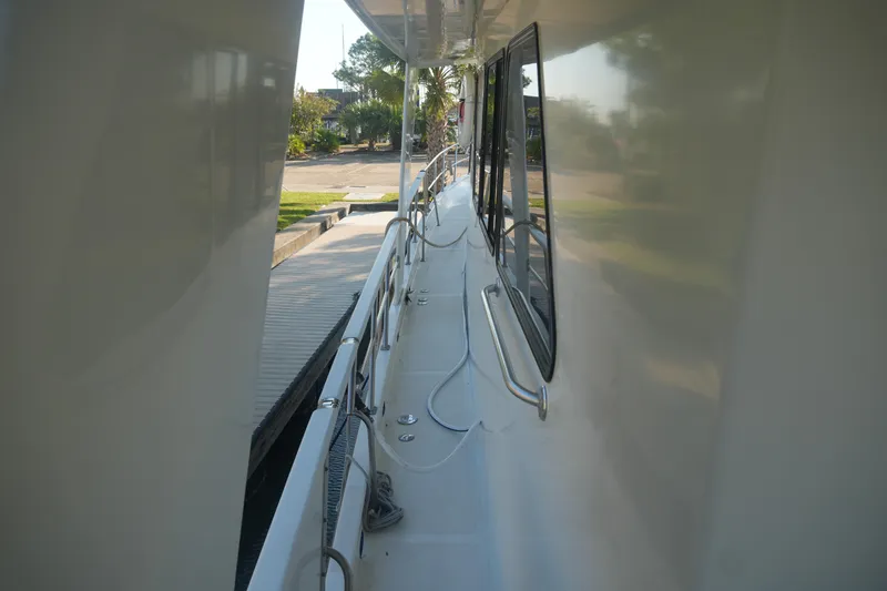 God's Favor Yacht Photos Pics 1986 DeFever 53 POC yacht deck view with railing and dockside perspective.
