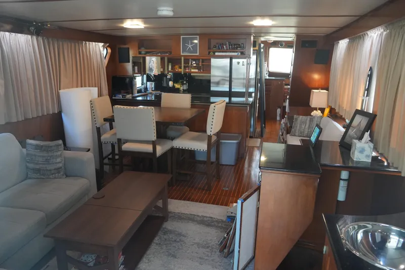 God's Favor Yacht Photos Pics Interior of 1986 DeFever 53 POC yacht with modern furnishings and wood accents.