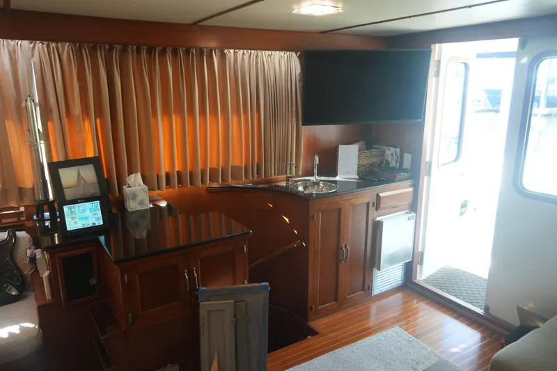 God's Favor Yacht Photos Pics Interior of 1986 DeFever 53 POC yacht with wood finish and modern amenities.