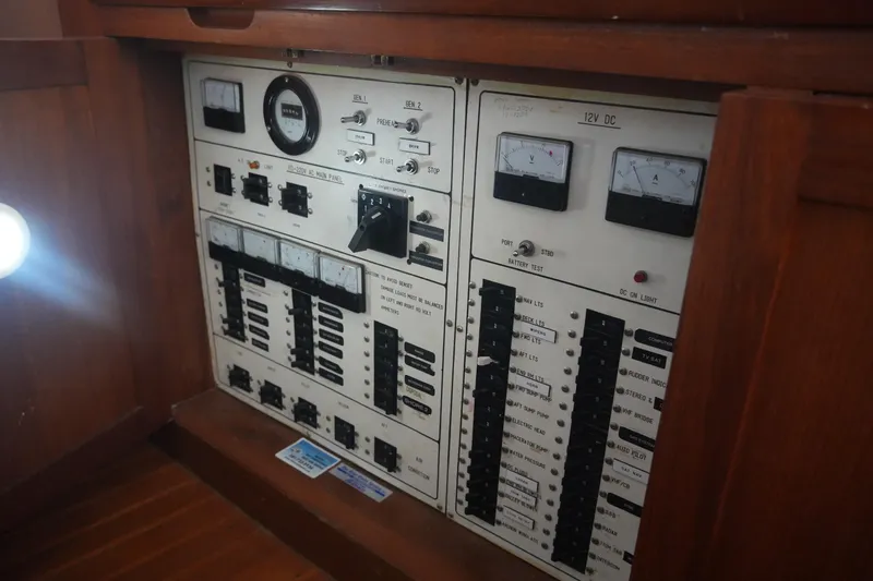God's Favor Yacht Photos Pics Electrical control panel on a 1986 DeFever 53 POC yacht, featuring gauges and switches.