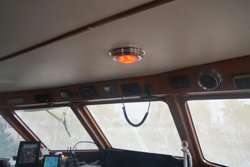 God's Favor Yacht Photos Pics Interior view of 1986 DeFever 53 POC yacht's helm with navigation equipment.