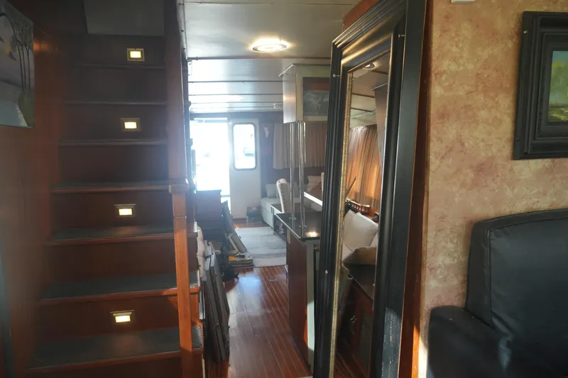 God's Favor Yacht Photos Pics Interior of 1986 DeFever 53 POC yacht with wooden stairs and elegant decor.