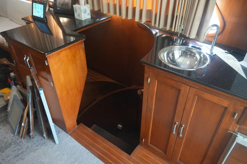 God's Favor Yacht Photos Pics 1986 DeFever 53 POC yacht interior with wooden cabinets and stainless steel sink.