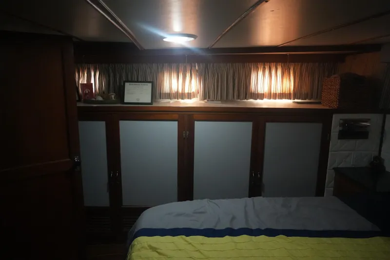 God's Favor Yacht Photos Pics Interior cabin of 1986 DeFever 53 POC yacht with cozy lighting and storage.